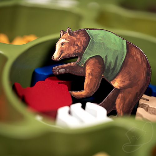Fun image of a bear meeple with the sticker applied rummaging through the meeple tray.